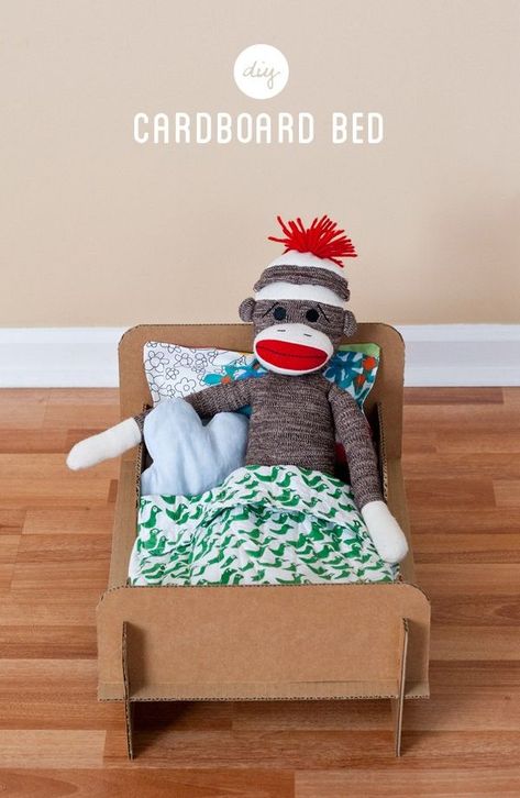 DIY cardboard doll bed | Cool Mom Picks Cardboard Bed, Carton Diy, Cardboard Toys, Doll Bed, Sock Monkey, Diy Cardboard, Cardboard Crafts, Diy Toys, Cardboard Box