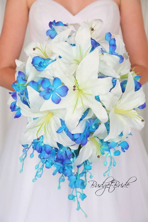 This is a cascading brides bouquet with blue orchids and delicate white casablanca lilies. All of our wedding bouquets are made with artificial wedding flowers. Casablanca Lilies, Blue Orchid Wedding, Bridal Wedding Flowers, Orchid Collection, Spring Wedding Bouquets, Blue Bride, Brides Bouquet, Orchid Wedding, Blue Wedding Flowers