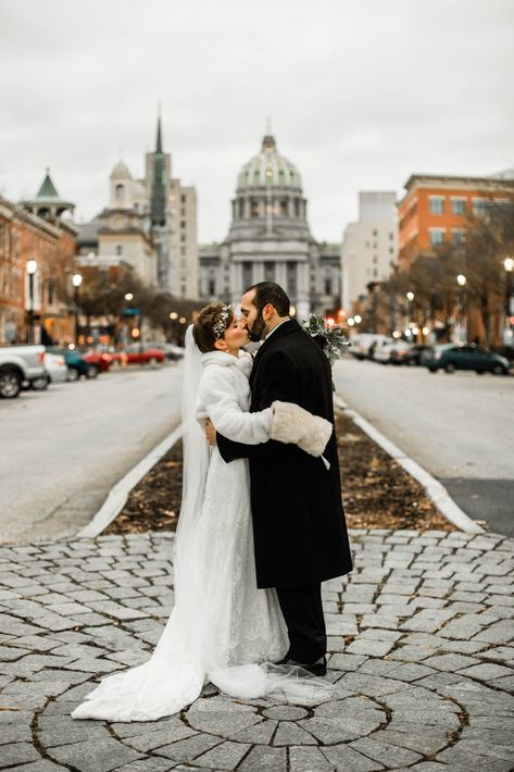 Sunset Wedding portraits on State Street in front of the Pennsylvania State Capitol Building in downtown Harrisburg. #harrisburgwedding #statecapitolportraits #winterwedding #bridalfurcoat #floralheadpiece #classicweddingportraits Capital Building, Classy Couple, Harrisburg Pa, State Street, Sunset Wedding, Capitol Building, Floral Headpiece, Groomsmen Attire, Formal Invitation