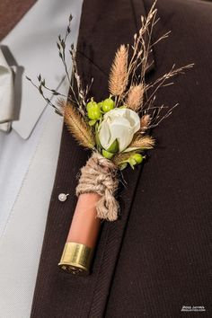 Clemmie Grace Designs, Columbia, Tennessee.  Shotgun shell boutineer.  Rustic.  Wedding. Cartridge Button Holes, Boutineer Ideas Wedding Rustic, Bootinterieur Wedding Diy, Cowboy Boutonniere, Rustic Hunting Wedding Ideas, Rustic Country Wedding Ideas Decoration, Shotgun Shell Boutineer, Rustic Boutineers, Bootinterieur Wedding