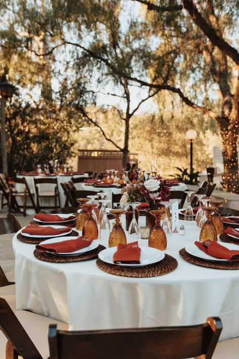 Sweetheart Table Terracotta, Terracotta Wedding Circle Table, Amber Goblets Table Setting, Terra Cotta Wedding Table Decor, October Wedding Table Settings, Maximalist Wedding Table Decor, Burnt Orange Table Setting Wedding Ideas, Amber Goblets Wedding, Amber Centerpiece Wedding Ideas