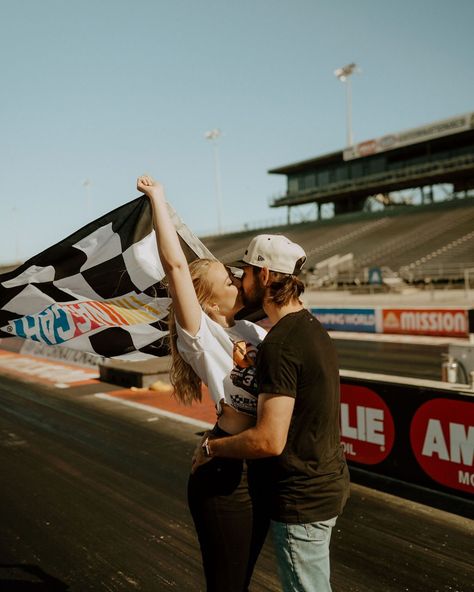 racing to the altarrrr 🏎️ 🏁 . . #racing #engagement #speedway Racetrack Engagement Pictures, Race Track Engagement Photos, Racing Couple Aesthetic, Race Car Engagement Photos, Racing Engagement Photos, Racetrack Photoshoot, Racing Wedding, Car Engagement Photos, Engagement Pose