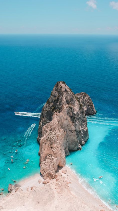 brown rock formation on body of water during daytime photo – Free Greece Image on Unsplash Greece Wallpaper, Zakynthos Greece, Parasailing, Visiting Greece, Beach Wallpaper, Beach Aesthetic, Greece Travel, Greek Islands, Australia Travel