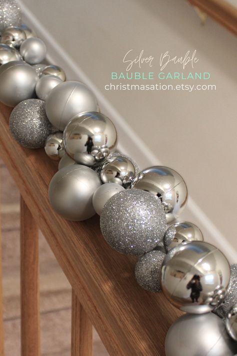 This exquisite Silver Bauble Garland features shiny, matte, and glittered ball ornaments. It can be used for any holiday or event decor, such as New Year's, weddings, Bridal showers, Bachelor or Bachelorette parties, birthday parties, baby showers, and more. It can be strung around a Christmas tree, on fireplace mantles, stair railings, around door and window frames, pews, side tables and more. Bauble Wreaths, Bauble Garland, Silver Baubles, Fireplace Mantles, Stair Railings, Small Business Gifts, Christmas Dog Collar, Shatterproof Ornaments, Party Garland