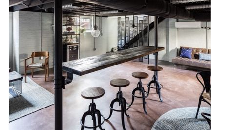 Industrial look. Custom table between basement columns. Basement Poles, Industrial Basement, Game Place, Basement Living Rooms, Small Basements, Walkout Basement, Exposed Brick Walls, Unfinished Basement, Basement Remodel