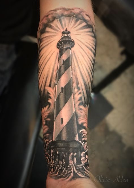 Cape Hatteras lighthouse black and grey forearm tattoo St Augustine Lighthouse Tattoo, Hatteras Lighthouse Tattoo, Cape Hatteras Lighthouse Tattoo, Wolf Paw Tattoos, Lighthouse Tattoo Meaning, Traditional Lighthouse Tattoo, Lighthouse Tattoos, Calf Tattoo Men, Hatteras Lighthouse