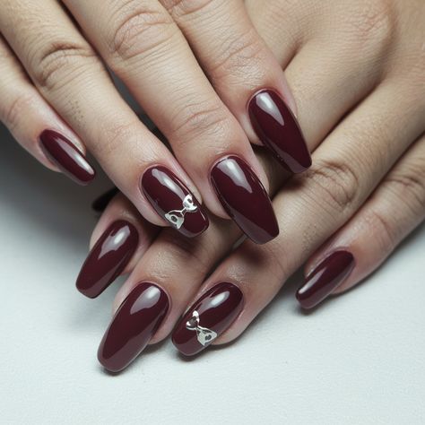 Fall in love with this stunning burgundy nail design featuring sleek almond shapes and eye-catching silver bow accents! The rich, glossy finish exudes elegance, making it perfect for any occasion, from date nights to festive gatherings. The playful bow detail adds a touch of whimsy, elevating the overall look. Get inspired to try this sophisticated manicure that balances classic beauty with modern flair! #septembernails #fallnails Burgundy Nail Designs, Sophisticated Manicure, September Nails, Burgundy Nails, Date Nights, Silver Bow, Silver Nails, Classic Beauty, Bow Detail