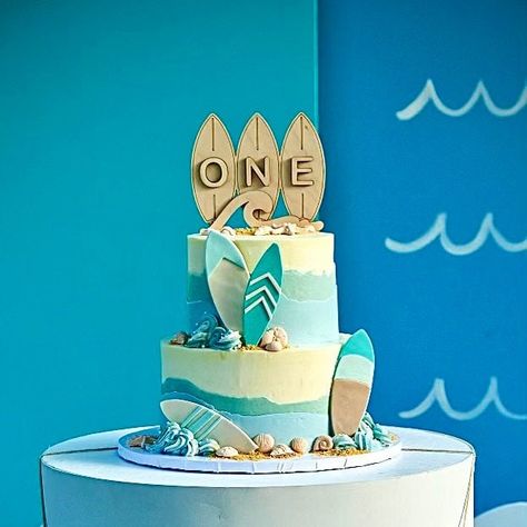 "Catch the wave to ONE with our Surfboard themed custom cake topper!! Sure to be hit with surfer boys and girls alike, this unique and handmade wooden birthday cake topper will add that final touch to your surf themed party. Size: 5.75\" x 4.5\" (Not including the stakes)." Surfboard Cake, Surfer Cake, Surfer Birthday, Surf Cake, Beach Theme Birthday, Surf Birthday Party, Surf Birthday, Surf Party, One Cake Topper