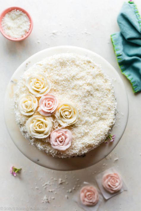 Fluffy and moist coconut cake! This coconut layer cake features shredded coconut, coconut milk, and cream cheese buttercream. Buttercream flowers make a gorgeous decoration for this cake recipe! sallysbakingaddiction.com Coconut Torte, Moist Coconut Cake, Coconut Sheet Cakes, Cake Flour Substitute, Cake Coconut, Sauteed Cabbage, Cake With Flowers, Cake 5, Coconut Cake Recipe