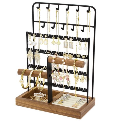 PRICES MAY VARY. 【Large Capacity Jewelry Stand】The jewelry organizer stand comes with 3 parts. A wooden ring box and jewelry box, one side is a hollow box to easily store perfume, lipstick, and the other side is a soft sponge box with 5 rows to keep the ring well protected. On the back is a 4-in-1 steel shelf with 96 holes 11 hooks, enough to store different necklaces, earrings. In the middle is an insertable string holder for good management of bracelets, watches. 【Tangle-free Necklace Holder】T Apartment Finds, Rings Display, Jewelry Organizer Stand, Wooden Brackets, Dorm Inspo, Hanging Necklaces, Tiered Necklace, Wooden Ring Box, Jewelry Rack