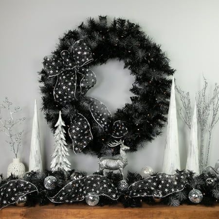 Incorporate natural textures like burlap ribbons, wood elements, and vintage-style lanterns. Think farmhouse-style signs with Christmas sayings, mason jar centerpieces with candles, and wooden sleighs or reindeer. Black Christmas Reef, Black And White Christmas Decorations, Black White Christmas Decor, Black And White Christmas Wreath, Black And Silver Christmas, Black Christmas Decor, Black And White Christmas Decor, Silver Christmas Wreath, Christmas Goals