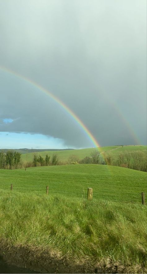 Pictures of a double rainbow overlooking a bright green field landscape- sky is a mixture of blue and grey and is half of the frame Running Through Grass Aesthetic, Grassy Hill Aesthetic, Grass Hills Aesthetic, Big Grass Field, Tall Grass Field, Sunny Grass Field Aesthetic, Blue Skye, Big Friends, Grass Field