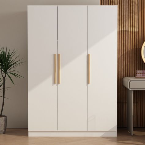 Willa Arlo™ Interiors Le placard à 3 portes est la solution idéale pour augmenter l'espace de rangement de la chambre tout en rehaussant l'effet décoratif. Cette armoire est faite de matériaux de haute qualité et est très durable et solide. Plusieurs tablettes internes sont utilisées pour ranger les jeans et les pantalons pliés. Cette grande armoire est idéale pour une chambre à coucher avec un décor moderne. Il est facile à entretenir et peut être nettoyé avec un chiffon. | Willa Arlo™ Interior 3 Door Wardrobe Design, Wardrobe Internal Design, Bedroom Armoire, Wardrobe Furniture, Wardrobe Armoire, Selling Furniture, Wardrobe Design, High Quality Furniture, Create Space