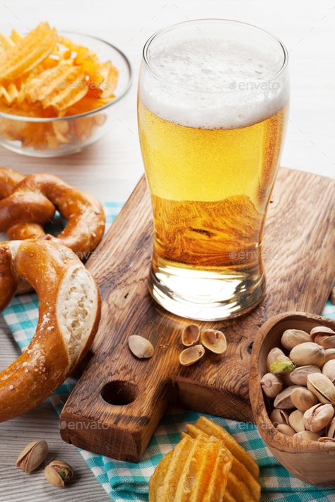 Lager beer and snacks by karandaev. Lager beer and snacks on wooden table. Nuts, chips, pretzel #AD #snacks, #karandaev, #Lager, #beer Beer And Snacks, Beer Snacks, Cooking With Beer, Lager Beer, Creative Advertising, Wooden Table, Nuts, Food Photography, Waffles