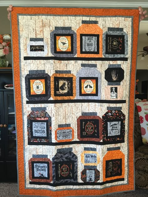 This is my apothecary quilt finished. The previous picture is without quilting and binding. It is from the pattern Stocked Up from Coach House Designs. The quilting pattern has spiders on it. Witchy Quilt Pattern, Halloween Quilt, Witches Quilt Pattern, Halloween Quilt Panels, Halloween Wall Hanging Quilt, Halloween Quilt Wall Hanging Free Pattern, Queen Of Ween Quilts, Halloween Apothecary Jars, Spooky N Witchy Quilt