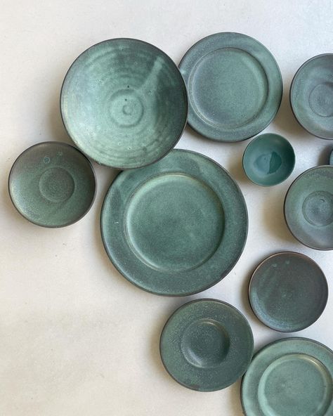 🙂 a sweet, unplanned, bottom of a plate surprise. We’ve been firing and photoing all these pools of green. They range in hue from oxidized copper, churned up pacific and deep shaded river green. All the same glaze, different temperatures! . They will be available online SATURDAY FEBRUARY 24 at 9 am pst with a preview up on Friday evening. Happy imminent spring! . Thank you @kleelarsen for all the help 👗 . #janakilarsenceramics #tablesetting #tableware #handmade #ceramics 9 Am, Friday Evening, Oxidized Copper, Handmade Ceramics, The Help, Glaze, Copper, Ceramics, Range