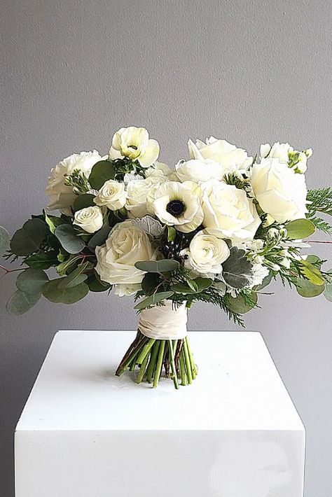 This winter wedding bouquet feels charming for your big day. As a wedding enthusiast, this floral selection elevates your wedding style. Save this to your wedding board. White Rose And Anemone Bouquet, Winter Wedding Bouquets Bride, All White Bouquet Wedding, Anemone Flower Bouquet, Wedding Anemone, Winter Wedding Flowers Bouquets, Anemone Bridal Bouquet, Benedict Casserole, Ranunculus Wedding Bouquet