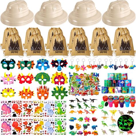 PRICES MAY VARY. Dinosaur Party Favors Includes: 12 pcs party hats, 12 pcs drawstring bags,12 pcs dinosaur masks, 12 pcs slap bracelets, 12 pcs dinosaur stamps, 12 pcs dinosaur key chains, 50 pcs dinosaur stickers, 12 pcs dinosaur make a dinosaur face DIY stickers, 12 pcs dinosaur rings, 12 pcs little dinosaurs figures, 12 pcs dinosaur stress relief toys set Perfect Dinosaur Party Decorations: ideal presents and great party favors gifts for kids in celebrations with dinosaur theme; Dinosaur birt Dinosaur Party Bags Diy, Dinosaur Goodie Bags Ideas, Dinosaur Goody Bag Ideas, Dinosaur Rings, Dinosaur Masks, Dinosaur Party Hats, Jungle Explorer, Explorer Party, Dinosaur Stamps