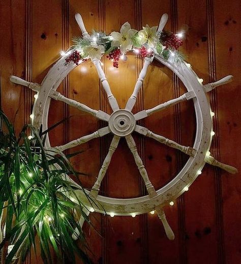 A great nautical Christmas wreath idea using a ship wheel. Featured on Completely Coastal with many other inspirational ship wheel decor ideas for the wall. Wheel Christmas Wreath, Nautical Christmas Decor, Ship Wheel Decor, Wheel Wall Decor, Captains Wheel, Christmas Wall Decor Diy, Diy Nautical Decor, Coastal Christmas Decor, Florida Christmas