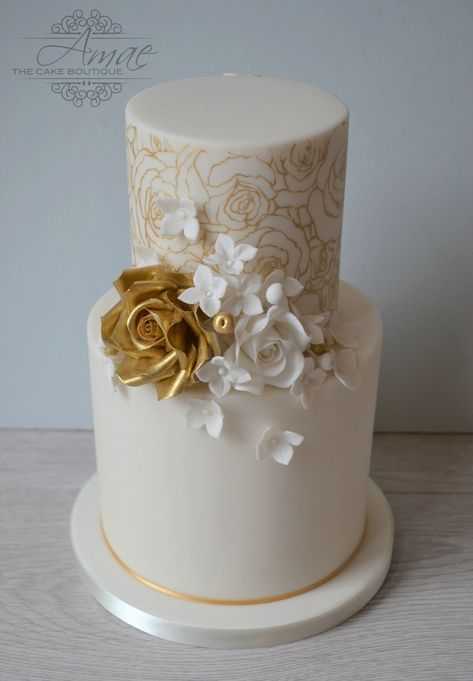 Ivory and gold wedding cake Ivory And Gold Wedding Cake, Champagne Gold Wedding Cake, White And Gold Wedding Cake Elegant, Gold And White Wedding Cake, Gold Foil Wedding Cake, Champagne Wedding Cakes, Champagne Gold Wedding, Gold And White Cake, Hand Painted Wedding Cake