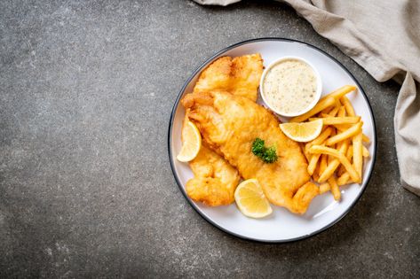 Fish and chips with french fries | Premium Photo #Freepik #photo Chip Photography, Grilled Fish Fillet, Fried Tilapia, Salmon Quinoa, Lemon Salad, Burger Menu, Salmon Steak, Salmon Avocado, Healthy Salmon