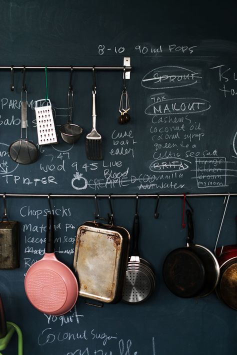 cookware + chalkboard wall Chalkboard Wall Kitchen, Warehouse Kitchen, Kitchen Chalkboard, Blackboard Wall, Dark Walls, Chalkboard Wall, Kitchen Pot, Chalkboard Paint, The Design Files