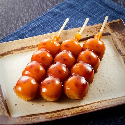 A japanese recipe of small ball-shaped mochi dumplings. Dango tastes like a sweet chewy sticky rice ball. Sometimes it is flavoured with strawberry or matcha powder or even with a sauce. Dango is made of consist of rice flour, glutinous rice flour, icing sugar and water. Dango is a Japanese dumpling made from rice flour mixed with uruchi rice flour and glutinous rice flour. Generally, dango comes under the category of wagashi, and is often served with green tea. It is eaten year-round, but the d Recipe With Glutinous Rice Flour, Dango Recipe, Mitarashi Dango, Rice Flour Recipes, Flour Dumplings, Japanese Dumplings, Japanese Recipe, Glutinous Rice Flour, Rice Ball