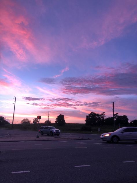 tis a pink and blue sunset on a street with two cars. Pink And Blue Sunset, Sunset Pink, Blue Sunset, Pink Sunset, Pretty Things, Cars, Wall, Pink, Blue