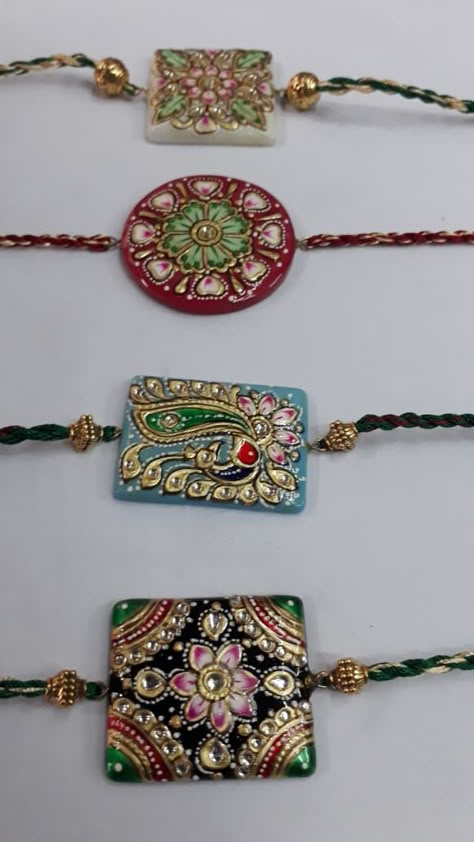 Tanjore Pendants, Clay Rakhi, School Decorations Diy, Couple Rakhi, 3d Relief Art, Handmade Rakhi Designs, Wedding Packing, Mural Art Design, Rakhi Making