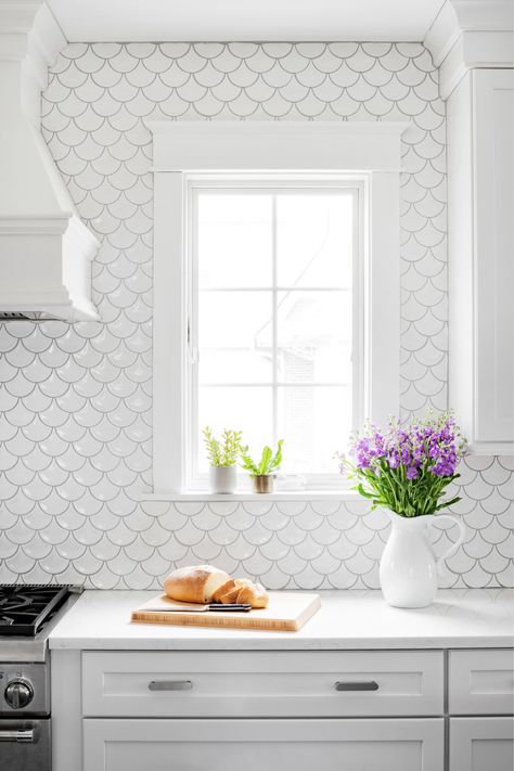 Kimberly Barr Interior Design Scallop Backsplash, White Stone Backsplash, White Luxury Kitchen, White Quartzite Countertops, Scallop Tiles, Backsplash For White Cabinets, Beach Style Kitchen, White Countertop, White Subway Tile Backsplash