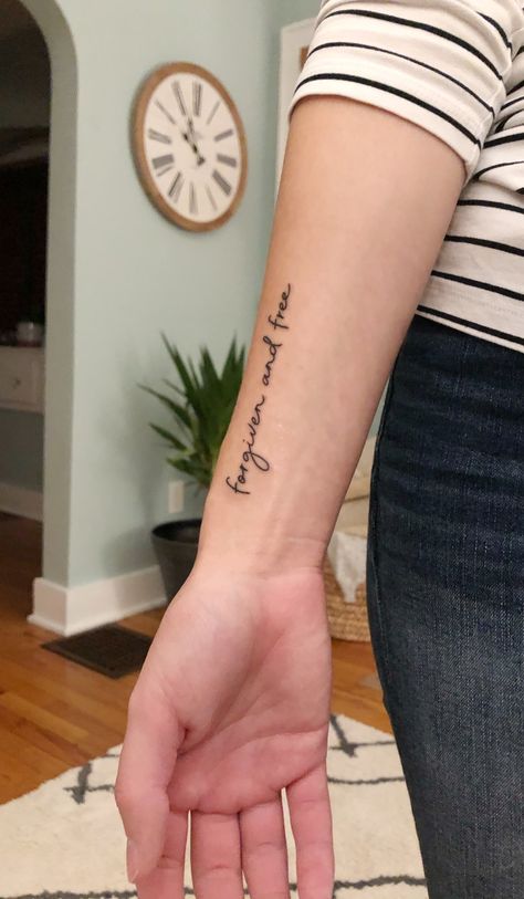 My wrist tattoo that says “Forgiven and Free” Christian Wrist Tattoos, Side Forearm Tattoos For Women, Wrist Tattoos Quotes, Forgiveness Tattoo, Inner Wrist Tattoos, Scripture Tattoos, Grace Tattoos, Forearm Tattoo Quotes, Side Wrist Tattoos