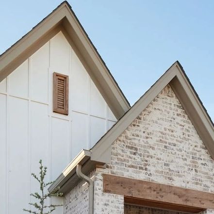 German Smear Brick With White Siding, White Stucco House With Wood Accents, Brick And Hardy Board House Exterior, Brick With Board And Batten Exterior, White Brick House With Wood Accents, White House Wood Accents Exterior, Brick Skirting House Exterior, Beige Brick House, French Exterior Homes