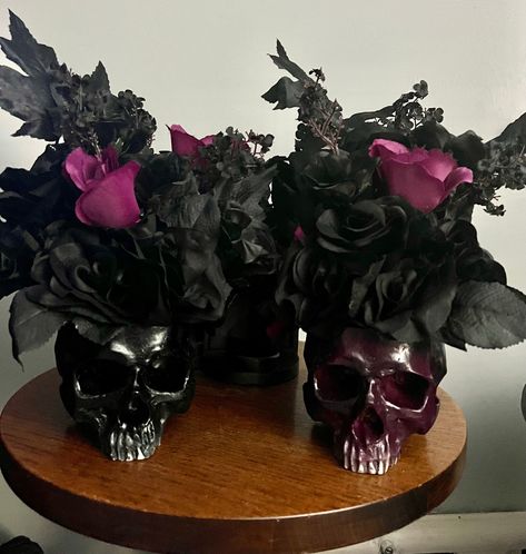 "Gothic pair skull head tall flower pot wedding centerpiece filled with black roses, magenta roses, black rose buds and black stem accents, arranged in aCeramic skull pot. Skull flower pot centerpiece is super full with stems and picks, stands approx 14\" tall x 12\" wide pair bride & groom, black and purple magenta Super elegantly goth, Victorian dark, everyday gothic decor, table centerpiece, accent piece Great gothic home accent or gift. Anniversary, birthday or dark wedding centerpiece" Gothic Party Centerpieces, Goth Table Decor, Goth Wedding Ideas Decor, Gothic Victorian Wedding Theme, Goth Wedding Centerpieces, Black Centerpieces Wedding, Gothic Centerpieces, Goth Wedding Decorations, Gothic Wedding Centerpieces