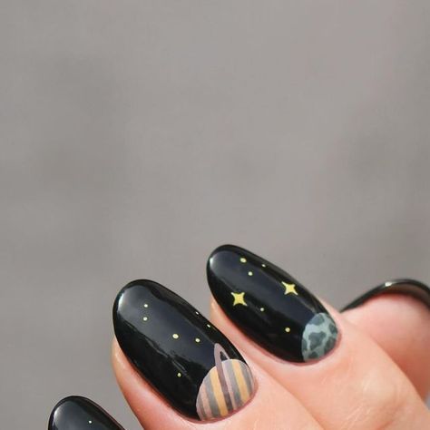 Eva on Instagram: "When in doubt, I bring the planets out. It’s no secret that planet/space manis are my favorite and I’ve done many planet manis over the years. I’ve never done a half moon planet mani, (only actual half moons🌛) so I thought that would be fun!  AND I did both hands! When I do, I only do my other thumb but never a full mani, but this just called for it so I could get all the planets in. (I did want to show a pic of this, but the pictures of it turned out so bad, and my right hand really isn’t all that pretty.)  Really love how it turned out🪐🌍" Space Inspired Nails, Solar System Nails, Moon Design Nails, Black Moon Nails, Space Themed Nails, Planet Nail Art, Neutral Nail Art Designs, All The Planets, Neutral Nail Art