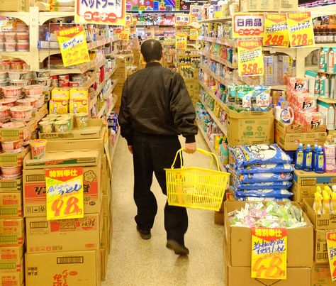 A shopper in Super Tamade's Chiyozaki branch. | NICK CURRIE Japanese Supermarket, Asian Supermarket, Potato Bowl, Cheap Food, Chop Suey, Roast Duck, Carrots And Potatoes, Artisan Cheese, Grocery Budgeting