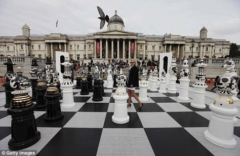 "A giant chess set was unveiled today in central London...The 32-piece set, featuring two-metre high ceramic pieces on a glass chess board, was installed this morning in Trafalgar Square. Created by Spanish designer Jaime Hayon, the chess board, named The Tournament, forms the centrepiece of [the 2009] London Design Festival & was partly inspired by Nelson's Battle of Trafalgar. Mounted on casters, many of the pieces are intended to reflect London's buildings, spires and domes." [1st of 3 pins] Chess Installation, Giant Chess Board, Glass Chess Board, Battle Chess, Giant Chess, Glass Chess, Boxwood Garden, London Queen, Play Therapy Techniques