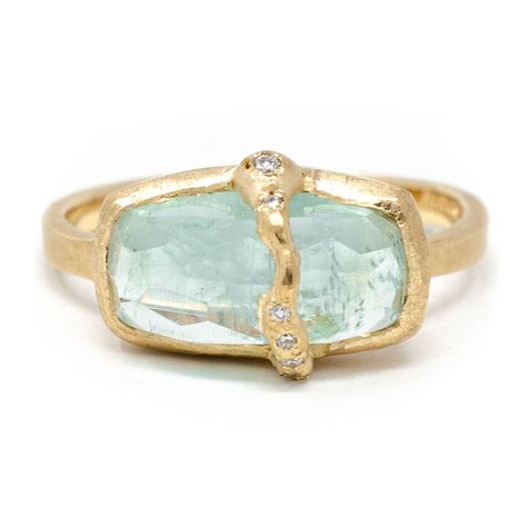 This sumptuously juicy aquamarine ring will have you thirsting for more. Diamonds flowing down the face of this imperfectly perfect pop of color. Celebrating our imperfections empowers us to see the true beauty that resides in us. Forged by our strengths and weaknesses, virtues and vulnerabilities, you are beautifully unique. A one of a kind just like this collection. Pictured in:14k yellow gold1.35ct Aquamarine.04ctw full cut white diamonds Aquamarine Ring Design, Tourmaline And Diamond Ring, Baguette Aquamarine Ring, Unique Stone Setting, Aquamarine And Diamond Ring, Funky Engagement Rings Unique, Sapphire Baguette Ring, Gold Aquamarine Ring, Colorful Rings