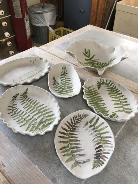 Students bisqued Fern Casseroles Plant Impressions In Clay, Advanced Pottery, Clay Impressions, Ceramic Plates Designs, Clay Kiln, Underglaze Painting, Plant Crafts, Clay Plates, Clay Stamps