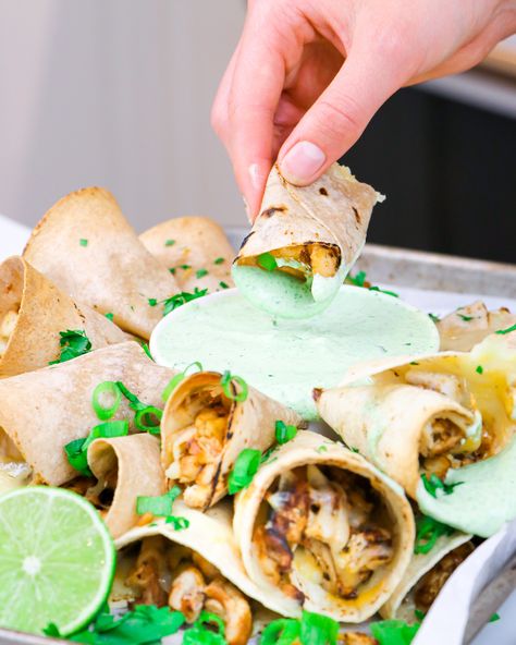 Sheet Pan Taquitos with Cilantro-Yogurt Sauce (Gameday Recipes) Taquito Sauce, Gameday Recipes, Oven Safe Bowls, Lime Cream, Yogurt Sauce, Lime Zest, Juicy Chicken, Game Day Food, Plain Greek Yogurt