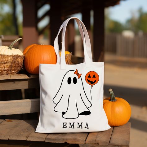 Personalized Halloween Trick or Treat tote bags are perfect for yourself or as a gift! A great bag for Halloween or goodie bag! Kids will love these cute and personalized bags for Halloween! Choose which ghost and add on option then add their name!  Dimensions: 15 inches Width 16 inches Height 0.39 inches Thickness 9.50 inches Handle drop 20 inches Handle length 1.26 inches Handle width These Natural Tote bags are made from 100% cotton Double sided printing available Care Instructions: Machine w Anniversary Gift Ideas For Him Boyfriend, Custom Halloween Bags, Halloween Paper Bags, Halloween Treat Holders, Machine Embroidery Gifts, Tote Bag School, Ghost Tote Bag, Handpainted Tote Bags, Personalized Canvas Tote