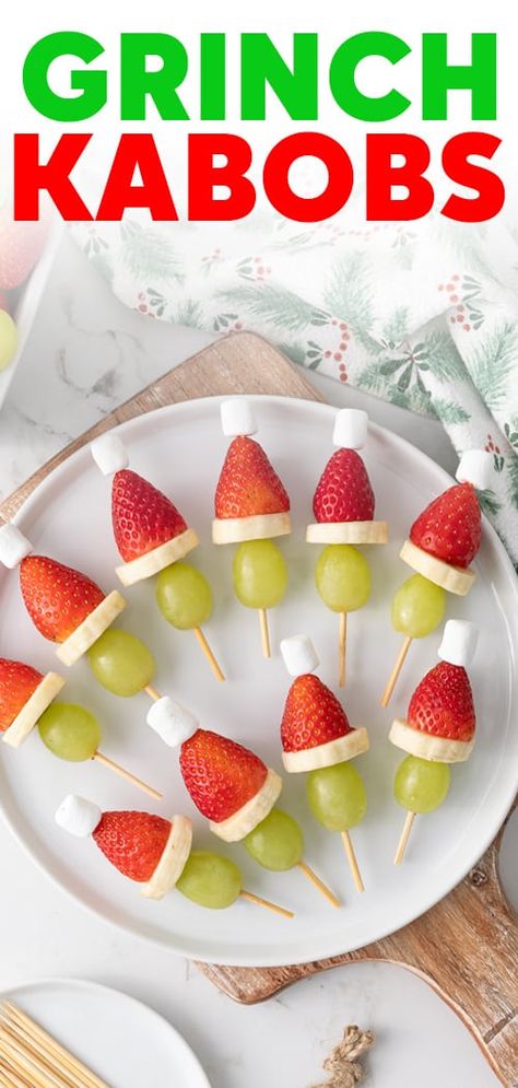 Get festive this holiday season with this cute and colorful Grinch Kabobs appetizer prepared with fruit and mini marshmallows! Grinch Fruit, Grinch Fruit Kabobs, Grinch Kabobs, Christmas Fruit Salad, Fruit Kabob, Healthy Holiday Treats, Fun Holiday Treats, Holiday Fruit, Christmas Snack