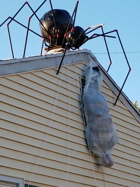 Giant spider and webbed victim Giant Spider Decoration, Diy Big Spider, Dormitory Hallway, Spider Web Decoration Outdoor, Giant House Spider, Halloween Core, Diy Spider, Scary Halloween Decorations Outdoor, Halloween Yard Art