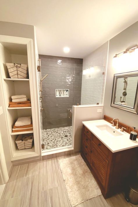 Our amazing remodeling team transformed our customer's bathroom into a calm oasis -- complete with a luxurious shower with new tiles and and built in cubbies to store linens and towels. Bathroom Built Ins, Built In Cubbies, Tub To Shower Remodel, Bathroom Transformation, Bathroom Redesign, Master Bath Remodel, Modern Farmhouse Bathroom, Bathroom Remodel Designs, Bathroom Layout