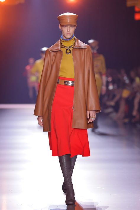 A model walks the runway at The Second Chapter Of The Hermes Women's Fall-Winter 2024 Collection at... Hermes 2024, Hermes Fashion, Yellow Cabs, Model Walks, East River, Boiler Suit, Scarf Top, Lower Manhattan, Printed Silk Scarf