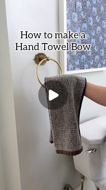 Jeff and Lauren on Instagram: "🎀 Easy bathroom towel bow! #bathroomdesign #towels #hosting #housekeeping #bow" Hanging Hand Towels In Bathroom, How To Decorate Bathroom Towels, How To Hang Towels In Bathroom, Towel Hanging Ideas Bathroom, Towels On Towel Bar, Hand Towels Bathroom Display, Bathroom Hand Towel Holder Ideas, How To Fold Hand Towels, How To Hang Bathroom Towels