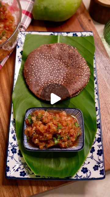 Meghna’s Food Magic on Instagram: "CHARRED TOMATO & RAW MANGO CHUTNEY WITH RAGI SESAME ROTI - Aam Se Kuch Khaas Ep. 24

Just whipped up a deliciously healthy meal of Charred Mango Tomato Chutney & Ragi Roti 🌿🍅 Ragi (finger millet) is a nutrient-rich grain that is packed with calcium, iron, and fiber. It’s gluten-free, easy to digest, and perfect for anyone looking to add some extra nutrition to their diet.

This dish combines the tangy sweetness of mango and tomatoes with the earthy flavor of ragi roti for a satisfying and nutritious meal. Plus, it’s super easy to make and perfect for a quick weeknight dinner.

Give this recipe a try and let me know what you think!
Method:
In a mixing bowl, take 1 cup Ragi Atta
Add Salt to taste 
Add 1/2 cup warm Water gradually
Knead a soft dough
Cover Ragi Roti Recipe, Ragi Roti, Raw Mango Chutney, Mango Cut, Roast Tomatoes, Ragi Recipes, Jaggery Powder, Finger Millet, Food Magic