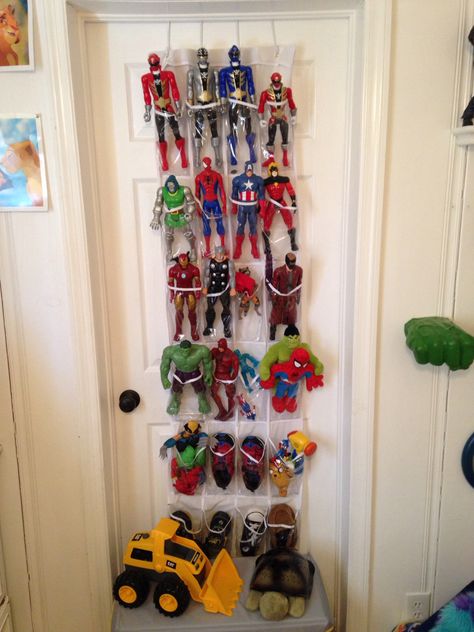 So Jaxon owns a lot of action figures that were taking over his toy box, looked around at some other storage ideas and found that plastic shoe racks are a great way to save room, and they can hang on a door! #room #bedroom #decor #actionfigures #toddler #superheroes #geek Action Figure Storage For Kids, Superhero Storage, Action Figure Storage, Super Hero Bedroom Decor, Superhero Room Decor, Marvel Bedroom, Ideas Habitaciones, Door Room, Boys Bedroom Makeover