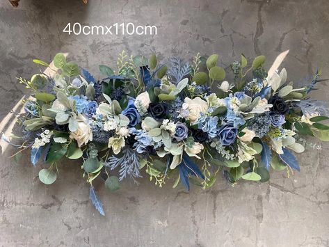 Blue And Gold Wedding Flowers, Blue Rustic Wedding Decor, Dusty Blue Wedding Theme Centerpieces, Dusty Blue Wedding Archway, Navy Blue Wedding Backdrop, Dusty Blue Wedding Arbor Flowers, Blue And White Flower Arch Wedding, Blue And White Flower Arch, Blue Wedding Backdrop