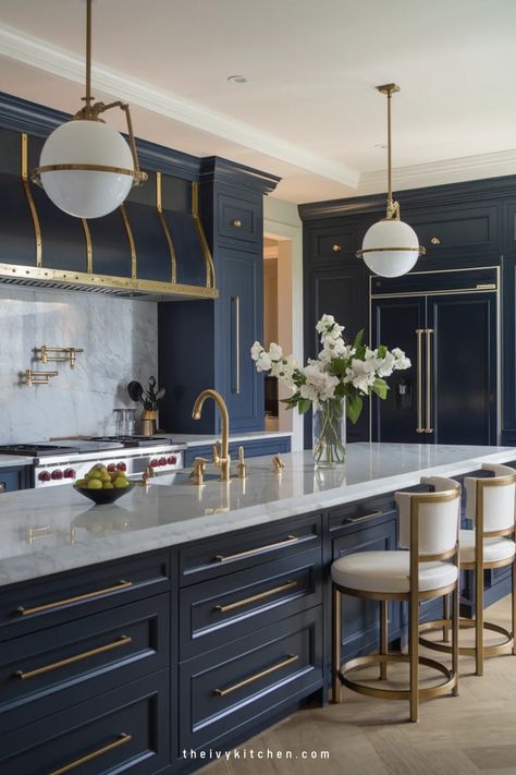 Luxurious kitchen with navy cabinets, gold accents, a marble countertop, and elegant pendant lights. Countertops For Blue Cabinets, Kitchen Sink In Island, Ivy Kitchen, Luxury Kitchen Designs, Modern Luxury Kitchen Design, Florida Kitchen, Kitchen Island With Sink, Unique Cabinet, Modern Luxury Kitchen