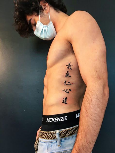 Rib Scar Tattoo, Men’s Tattoos Japanese, Men Tattoo Ideas Japanese, Japanese Symbol Forearm Tattoo, Japanese Spine Tattoo For Men, Japanese Word Tattoo Men, Japanese Letters Tattoo Men, Backbone Tattoo For Men, Japanese Symbol Tattoos Men